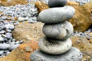 Rock cairn representing self care balance